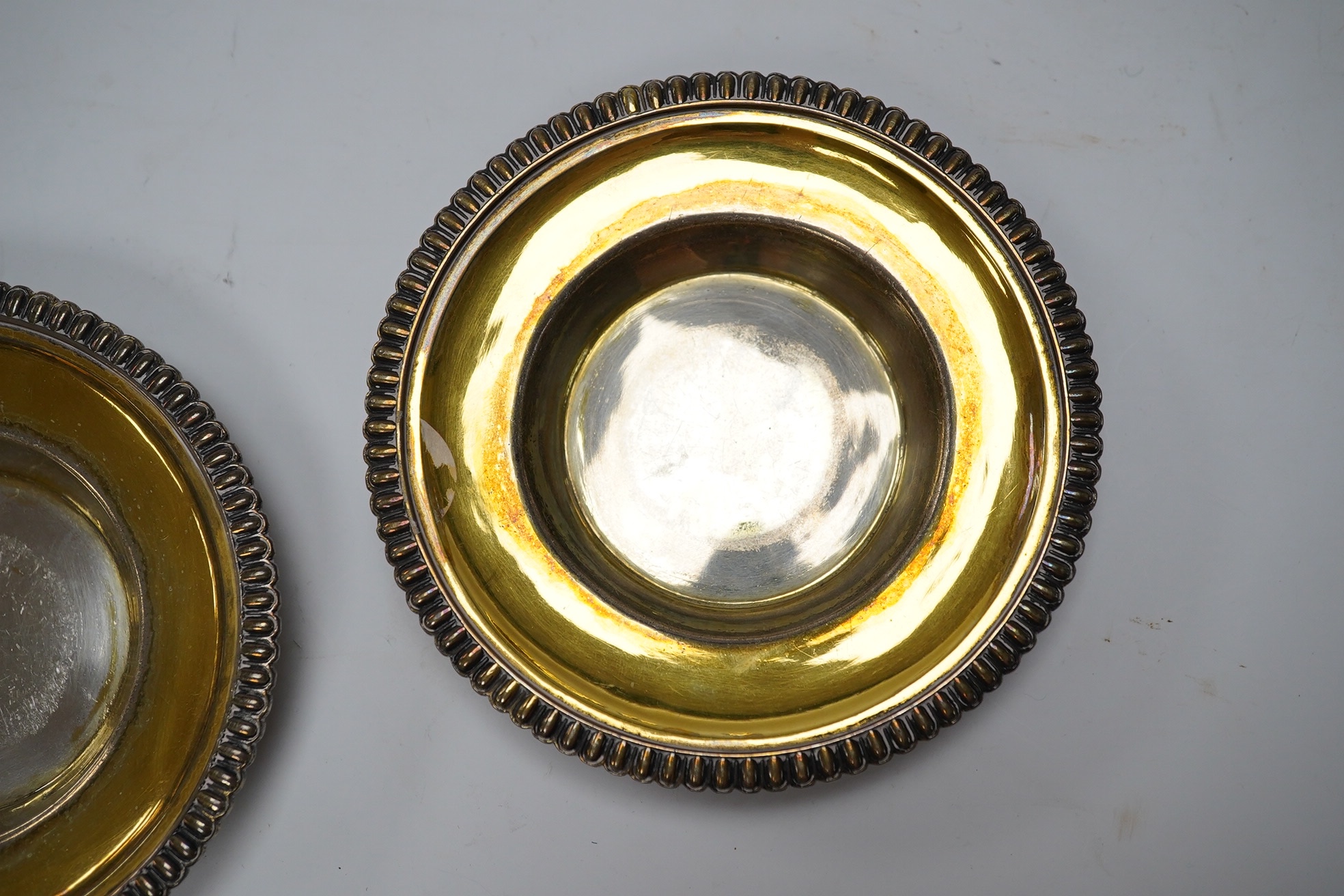 A pair of George III silver dishes or stands, with gadrooned borders, Emes & Barnard, London, 1814, diameter 10.9cm, 5.3oz.